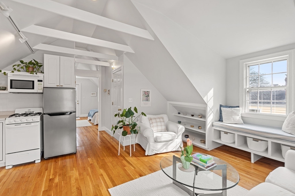 3 Circle Street, Unit 3 Marblehead, MA 01945 - Photo 10 of 23 a living room with furniture and a kitchen area
