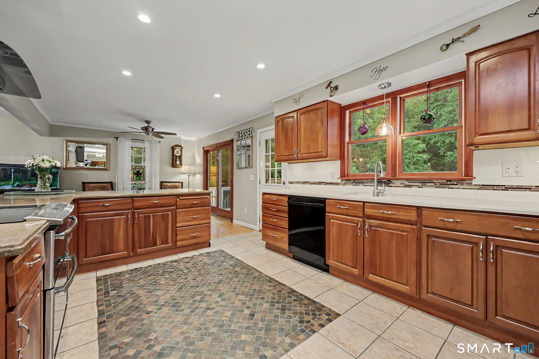 571 Wheeler Road Monroe, CT 06468 - Photo 9 of 40 a kitchen with stainless steel appliances granite countertop a stove sink and cabinets