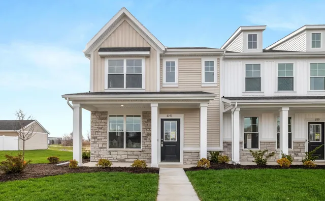 front view of a house with a yard