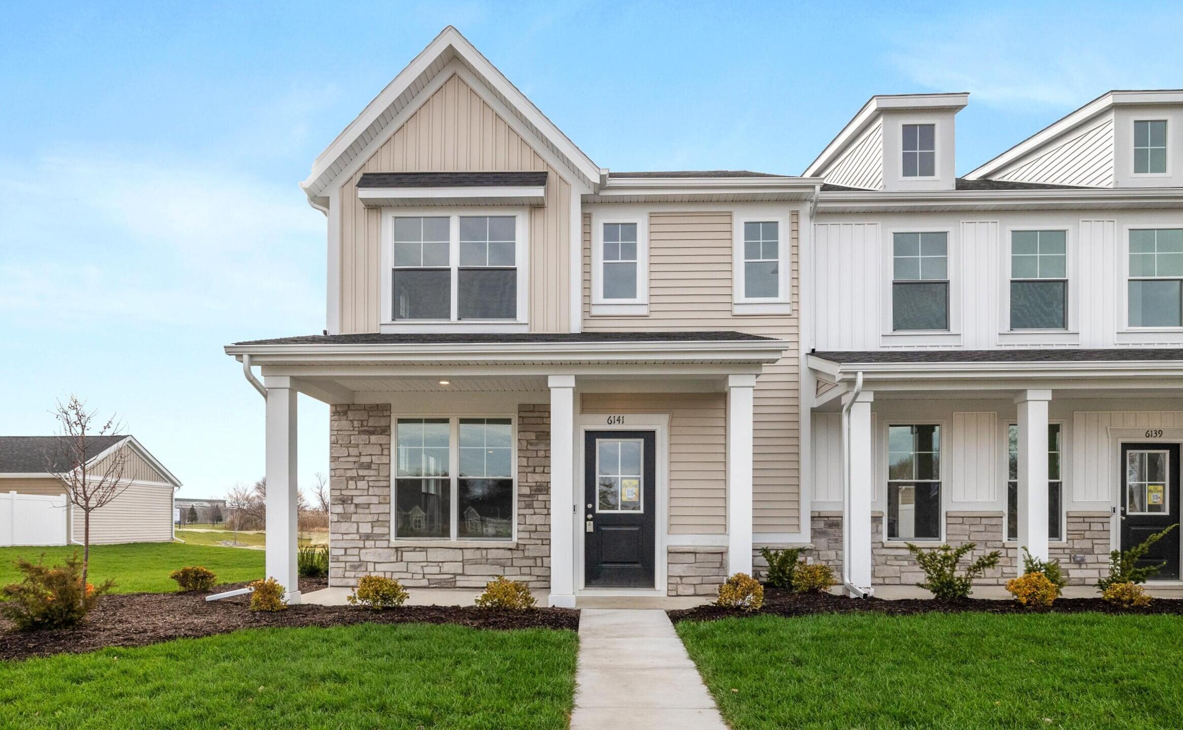 front view of a house with a yard