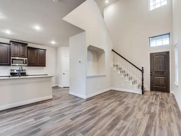 a view of kitchen with sink microwave and stove