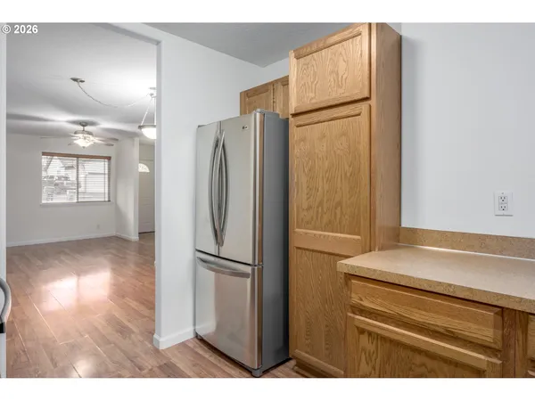 a kitchen with a refrigerator and a sink