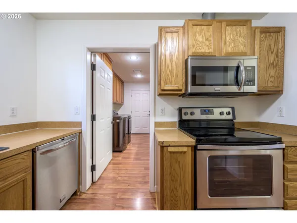 a kitchen with a stove and a microwave
