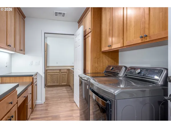 a kitchen with a stove and a microwave
