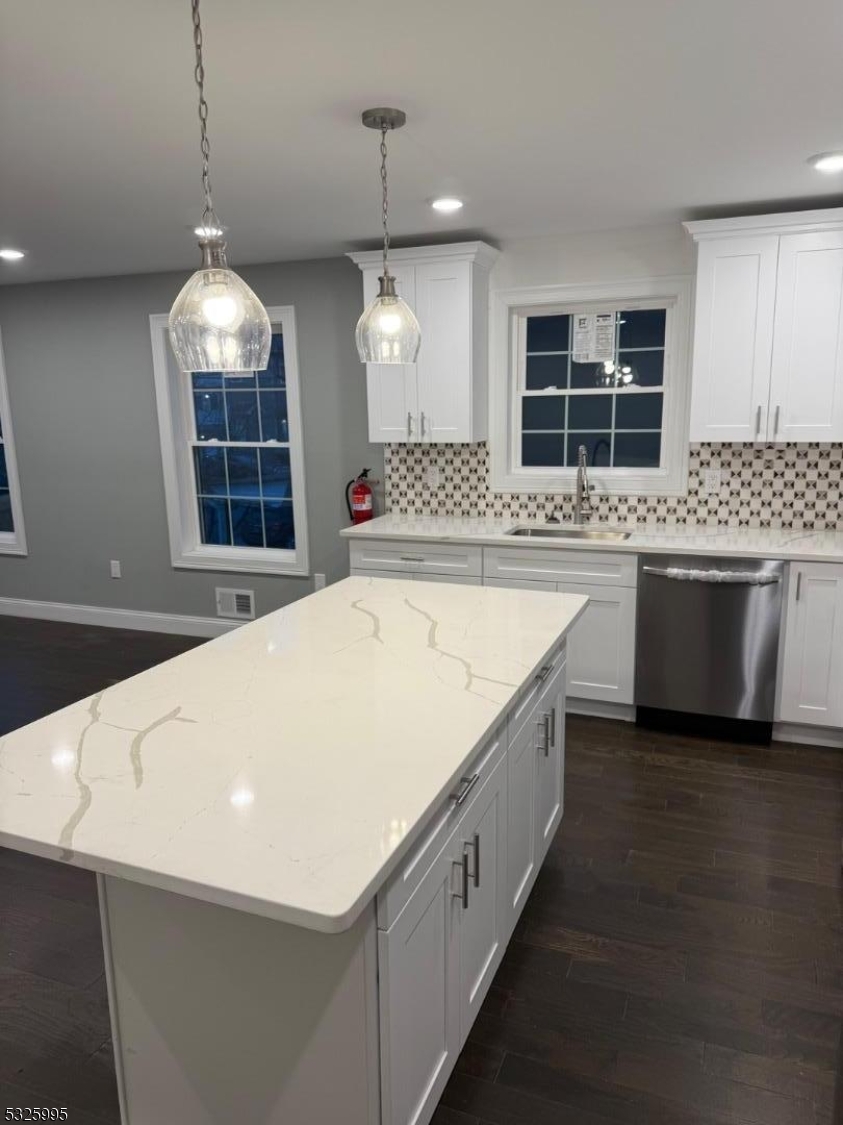 7 Maple Street Bloomfield, NJ 07003 - Photo 3 of 14 a view of a kitchen with a stove and kitchen island