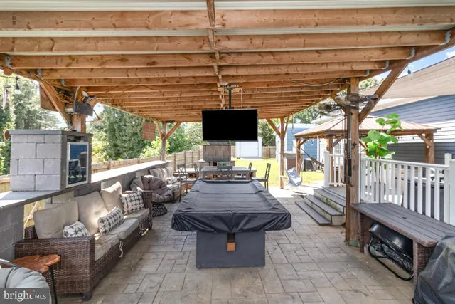 a view of patio with wooden floor