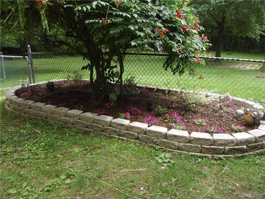 7494 Herbst Road Brighton, MI 48114 - Photo 16 of 33 New Retaining Wall Flower Beds