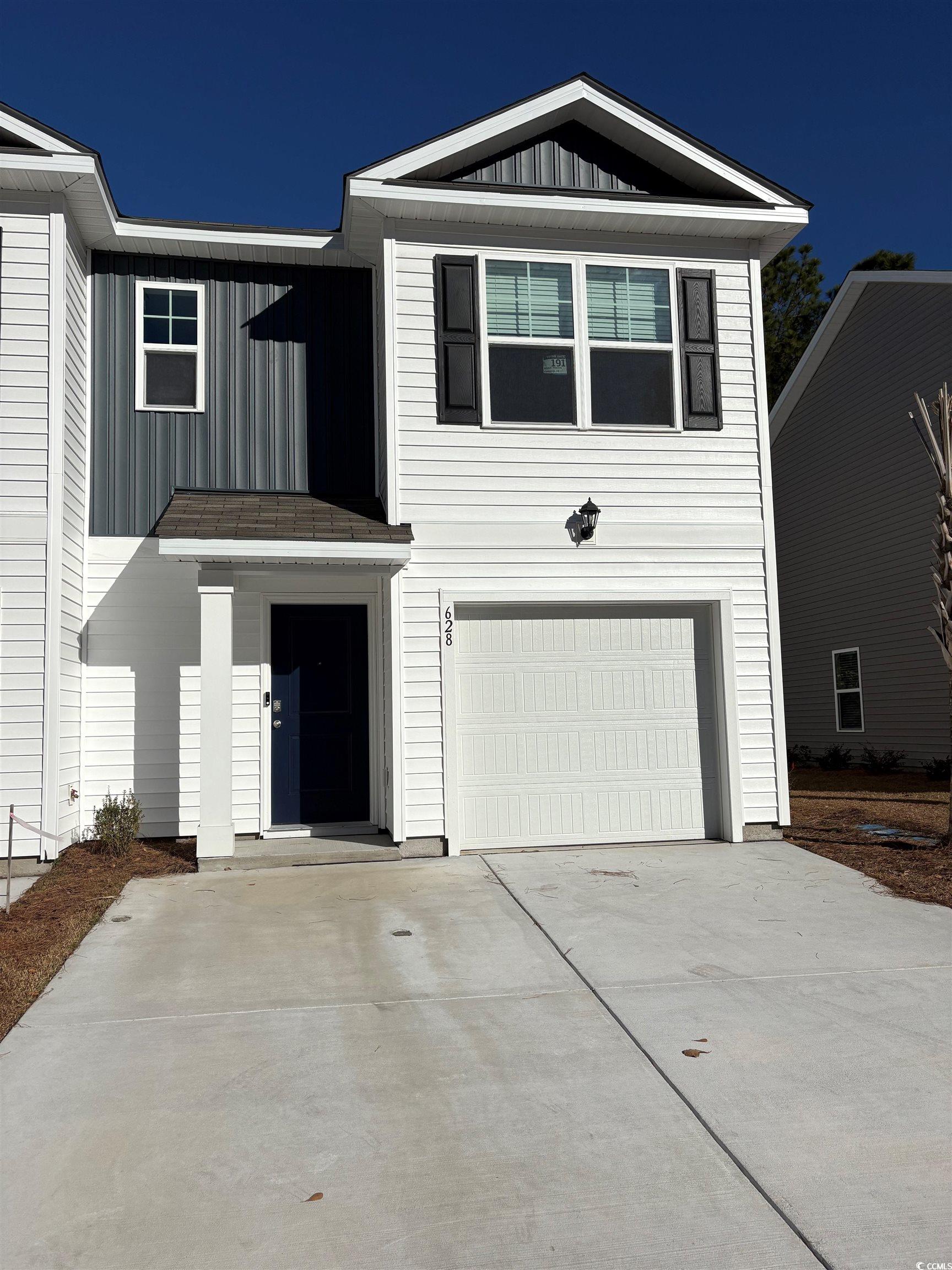 628 Golden Resin Road, Unit LOT 191 Conway, SC 29526 - Photo 1 of 40 View of front of property featuring board and batten siding, a garage, and concrete driveway