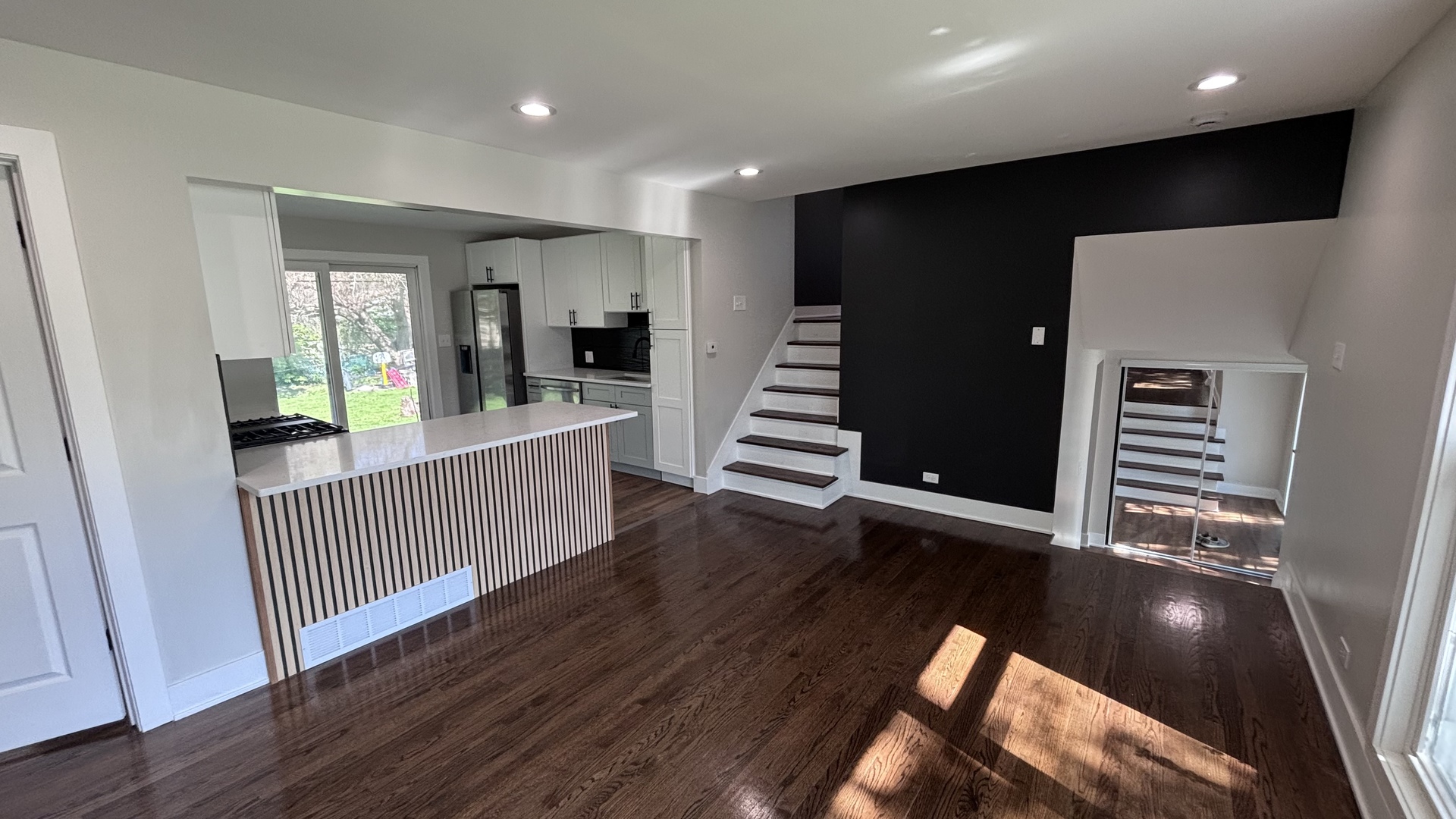 18314 Locust Street Lansing, IL 60438 - Photo 4 of 14 an empty room with wooden floor and windows