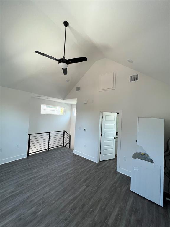 7603 Carver Avenue, Unit 2 Austin, TX 78752 - Photo 4 of 9 Dramatic vaulted ceilings and durable wood-look flooring define this versatile upstairs bonus room.