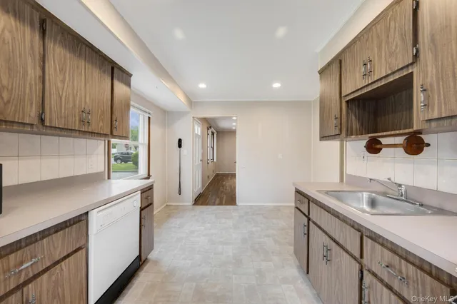 a bathroom with a double vanity sink a mirror and shower