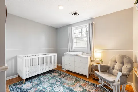 a bedroom with furniture and a window