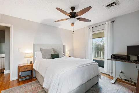 a bedroom with a bed and a desk