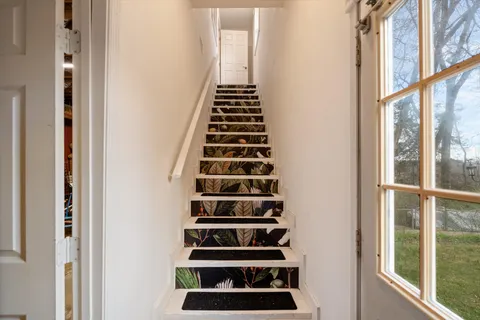 a view of a hallway with front door