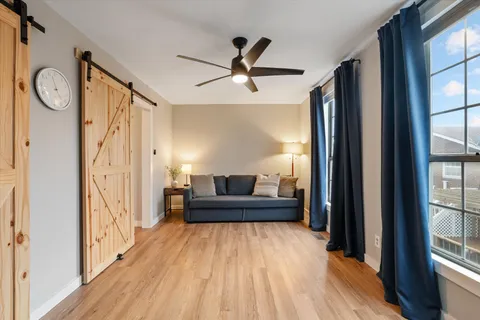 a living room with furniture and a window