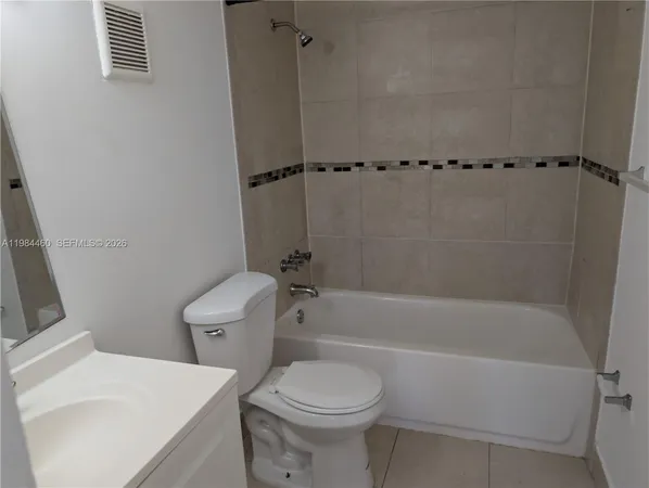 a bathroom with a toilet and a bathtub
