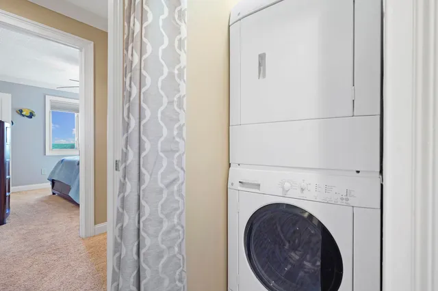 a view of a hallway with washer and dryer
