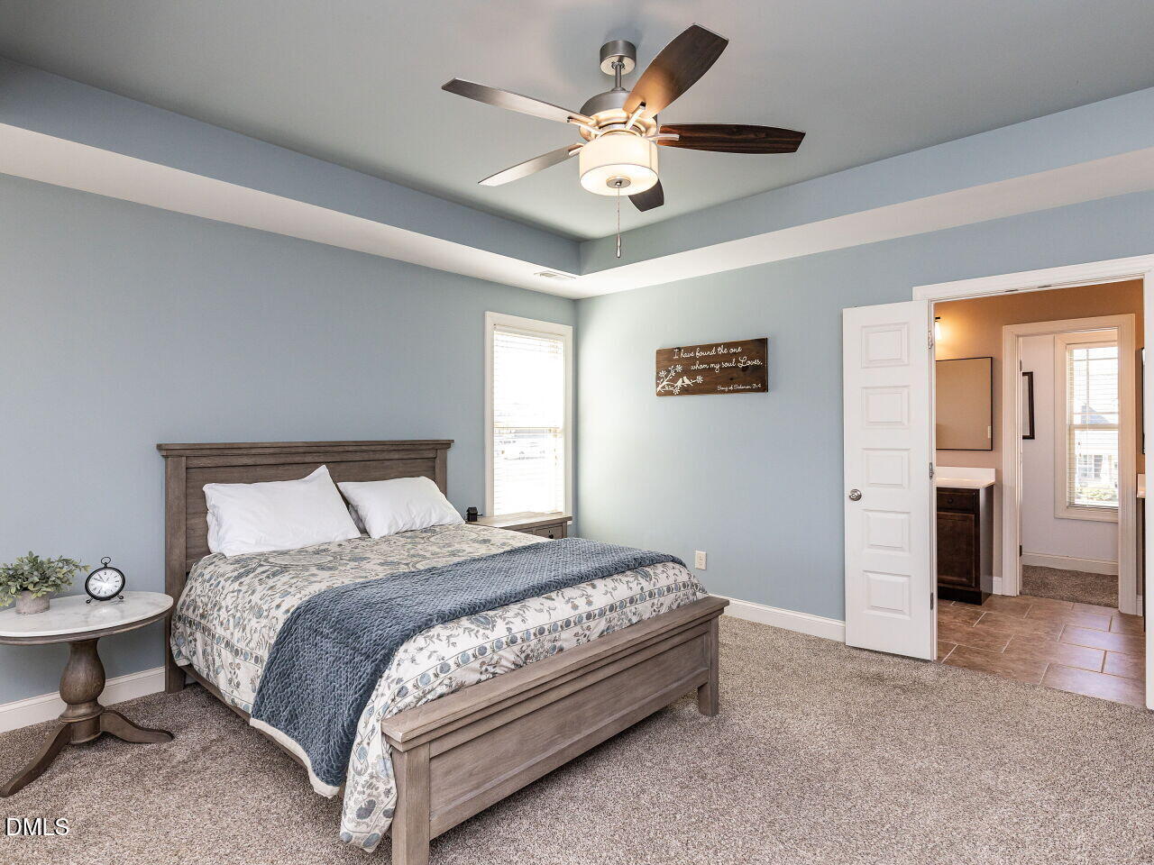 742 Adams Point Drive Garner, NC 27529 - Photo 11 of 31 a bedroom with a bed and a chandelier