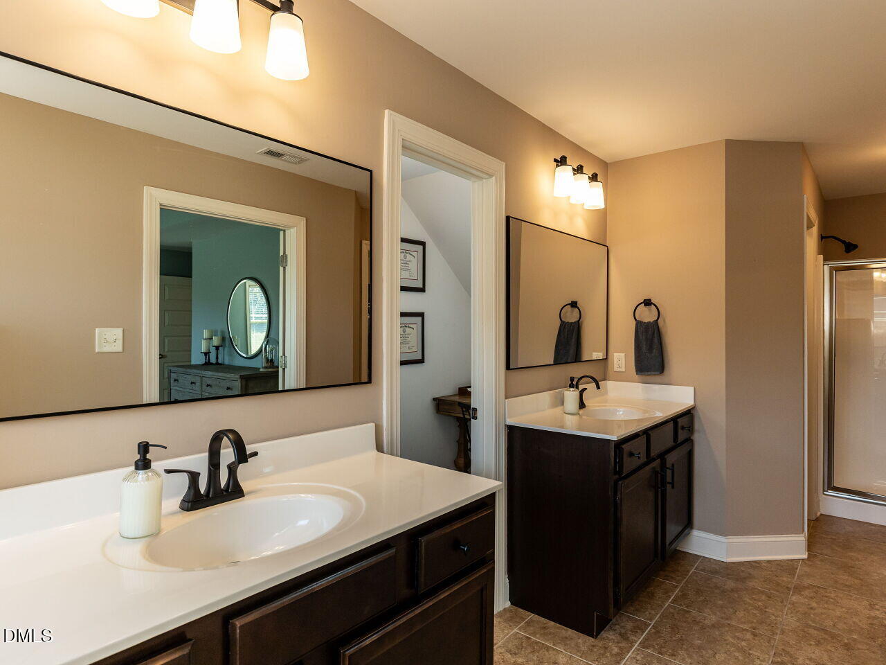 742 Adams Point Drive Garner, NC 27529 - Photo 15 of 31 a bathroom with a sink double vanity and a mirror