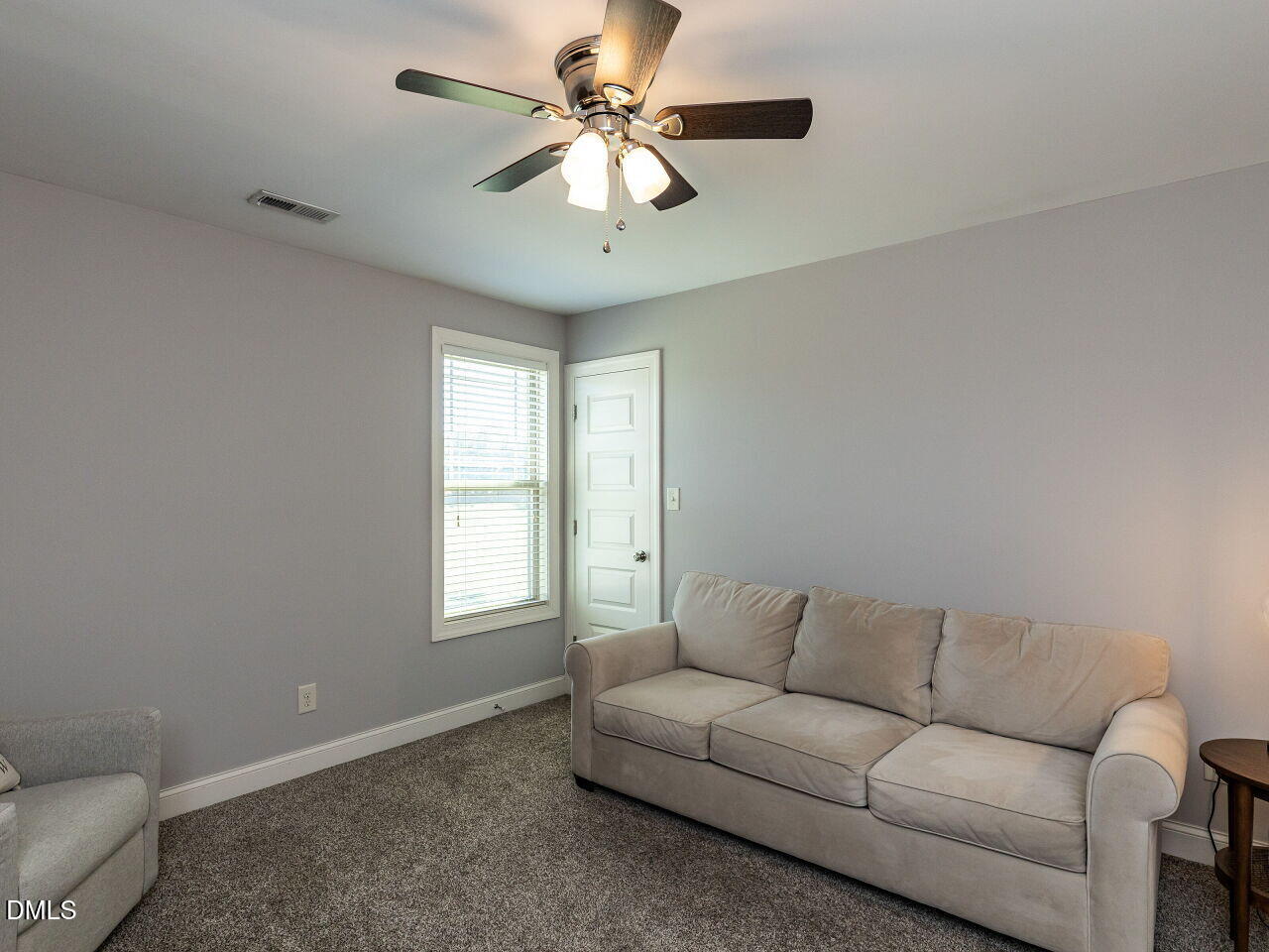 742 Adams Point Drive Garner, NC 27529 - Photo 17 of 31 a living room with furniture and a ceiling fan