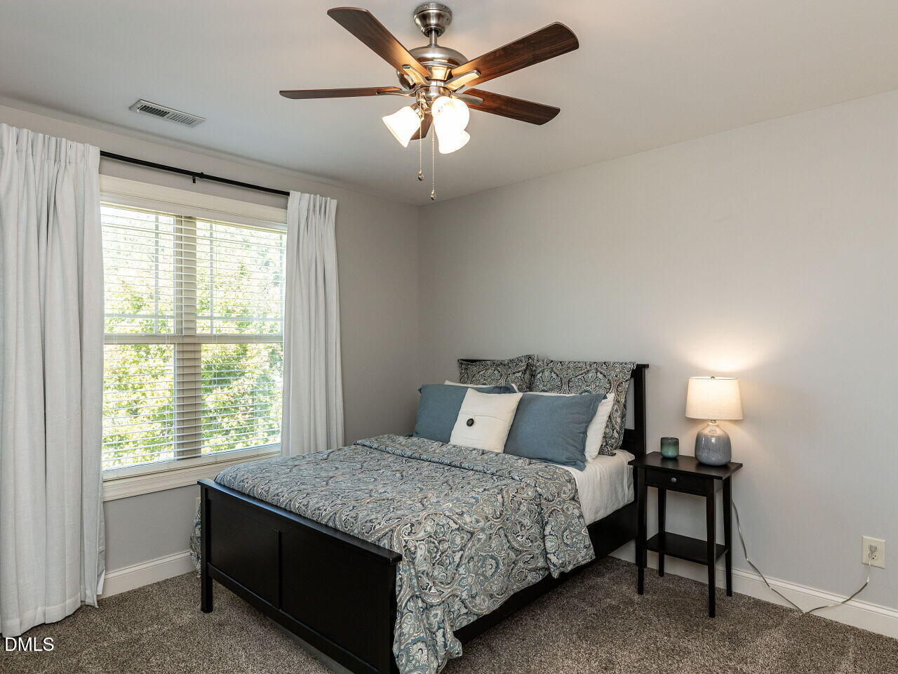 742 Adams Point Drive Garner, NC 27529 - Photo 20 of 31 a bedroom with a bed and a window