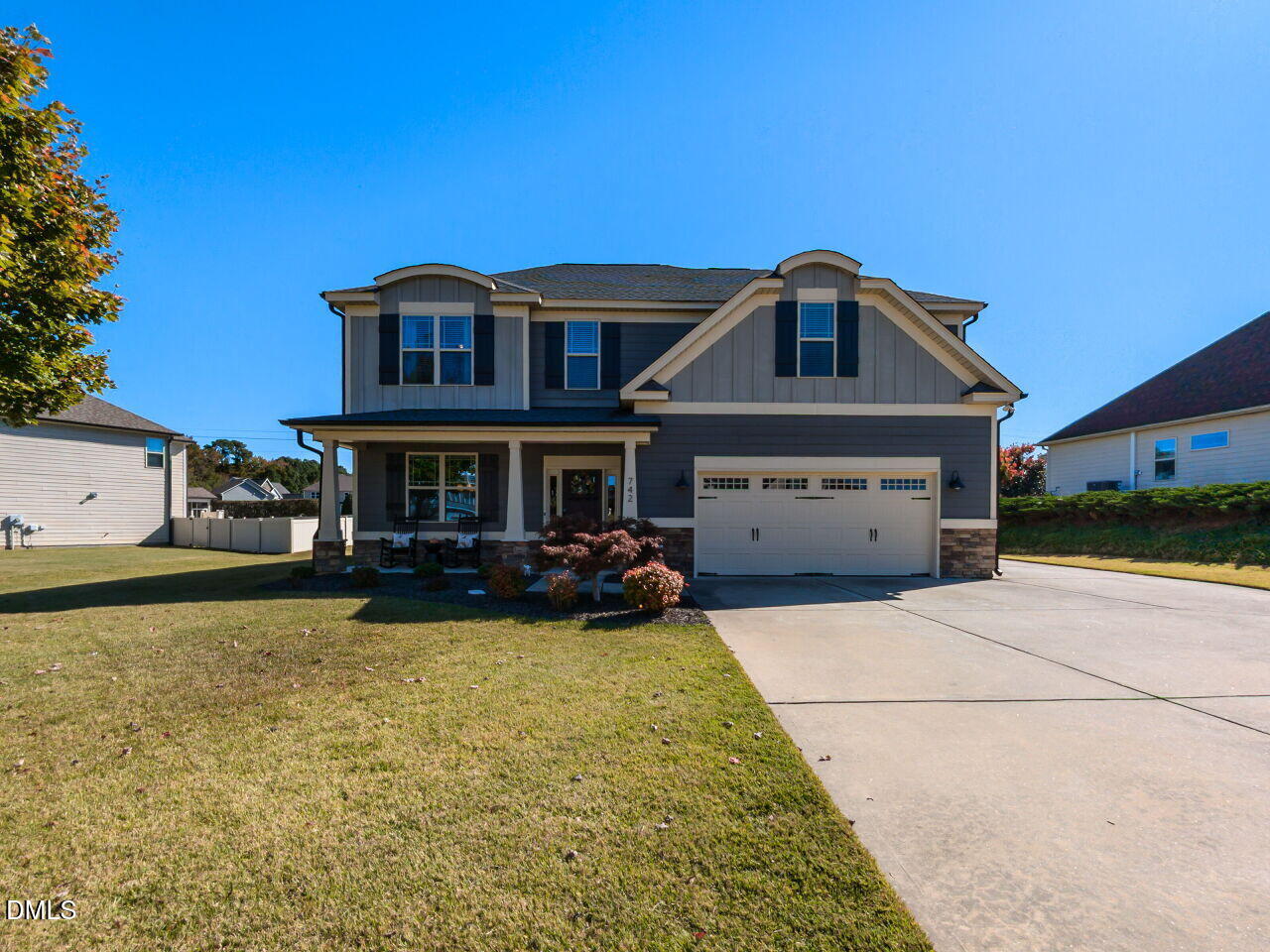 742 Adams Point Drive Garner, NC 27529 - Photo 2 of 31 a front view of a house with yard porch and outdoor seating
