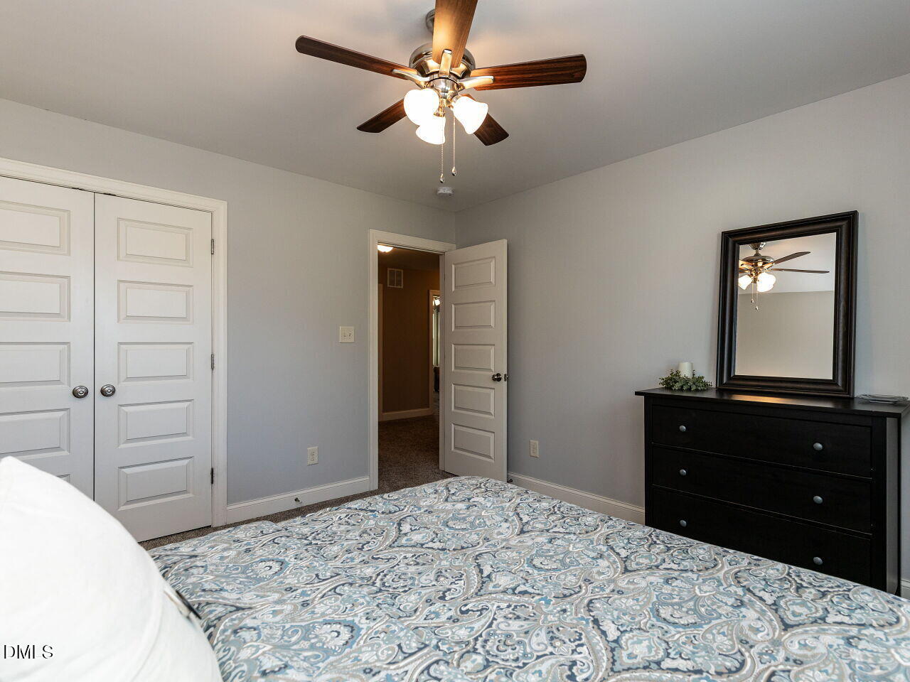 742 Adams Point Drive Garner, NC 27529 - Photo 21 of 31 a bedroom with a bed and a dresser