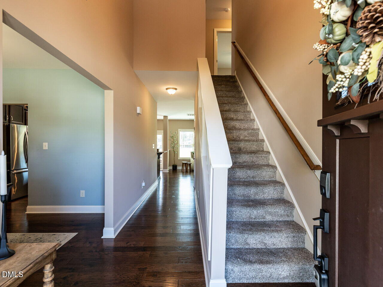 742 Adams Point Drive Garner, NC 27529 - Photo 3 of 31 a view of staircase with white walls and a window