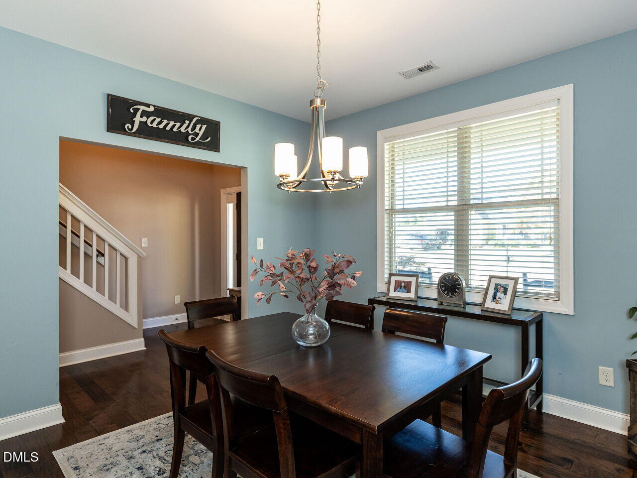 742 Adams Point Drive Garner, NC 27529 - Photo 5 of 31 a view of a dining room with furniture window and wooden floor