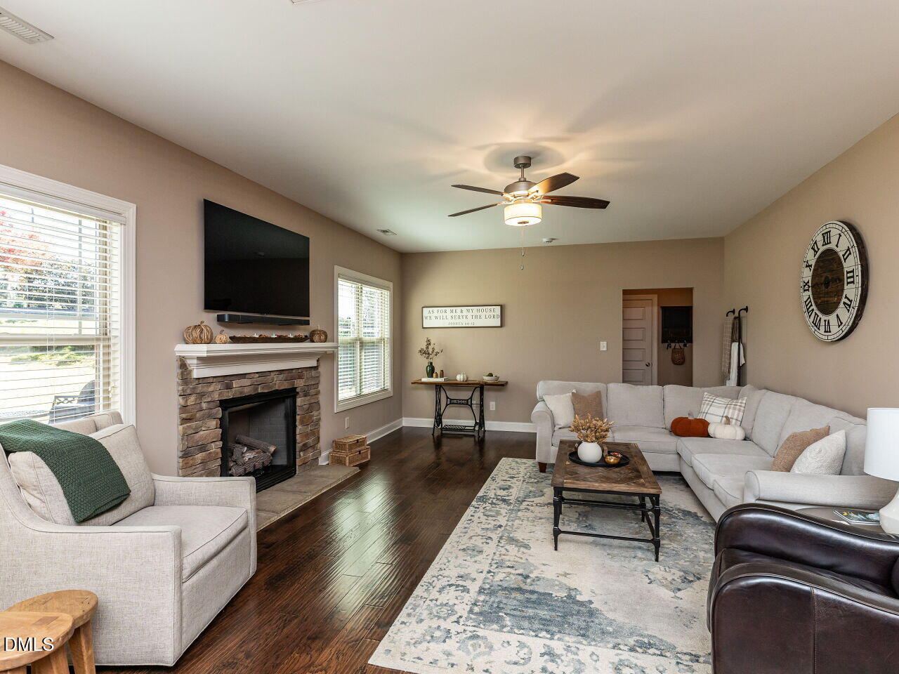 742 Adams Point Drive Garner, NC 27529 - Photo 9 of 31 a living room with furniture fireplace and a flat screen tv