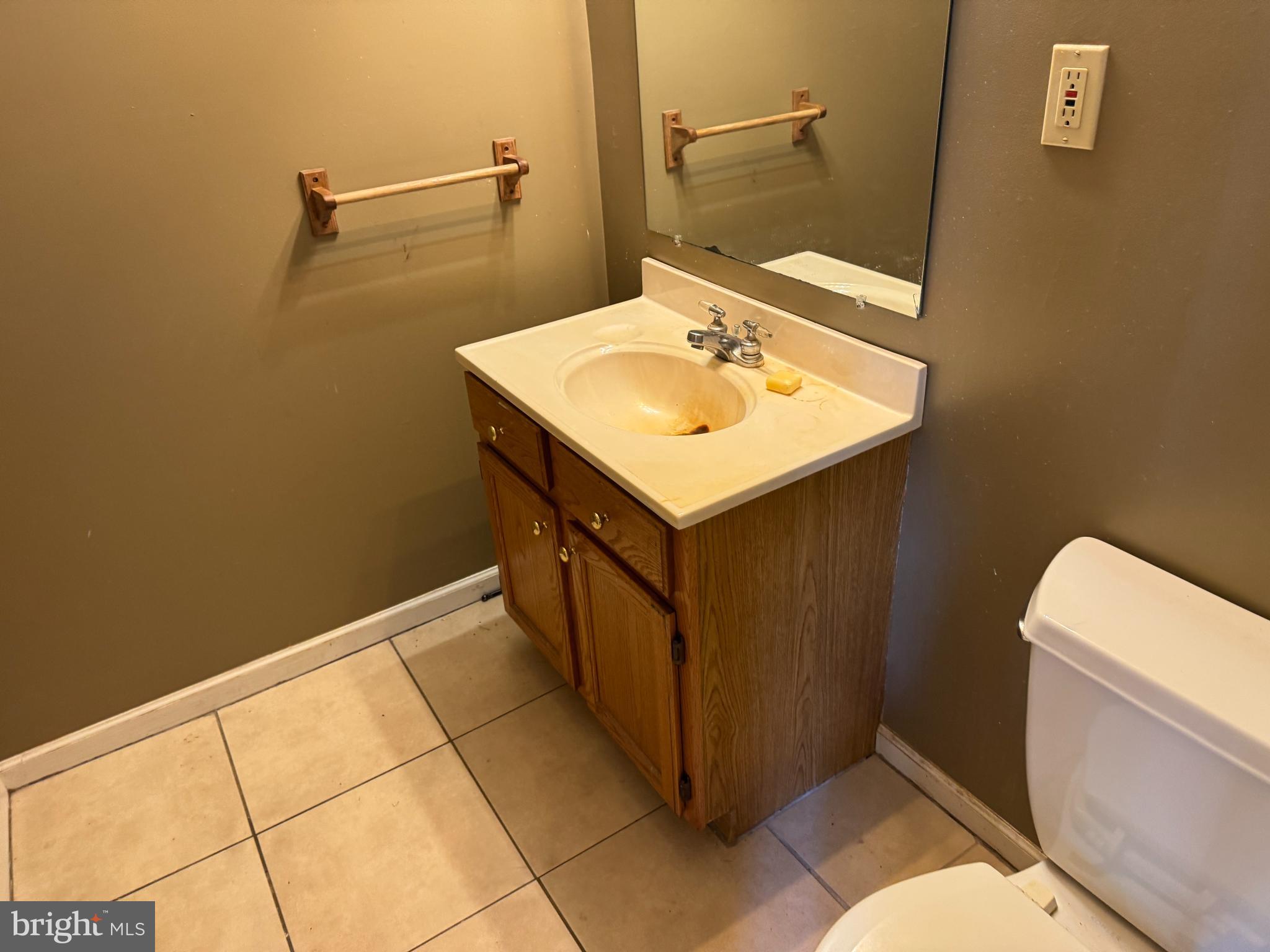8922 Carpers Pike Yellow Spring, WV 26865 - Photo 11 of 23 a bathroom with a sink toilet and vanity