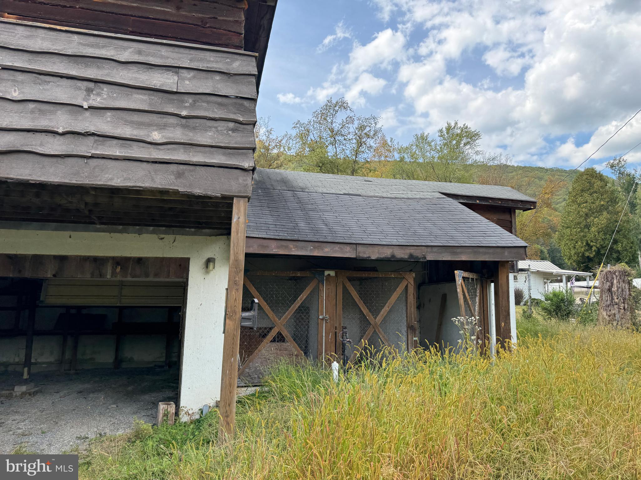 8922 Carpers Pike Yellow Spring, WV 26865 - Photo 22 of 23 a view of a backyard with plants and lake