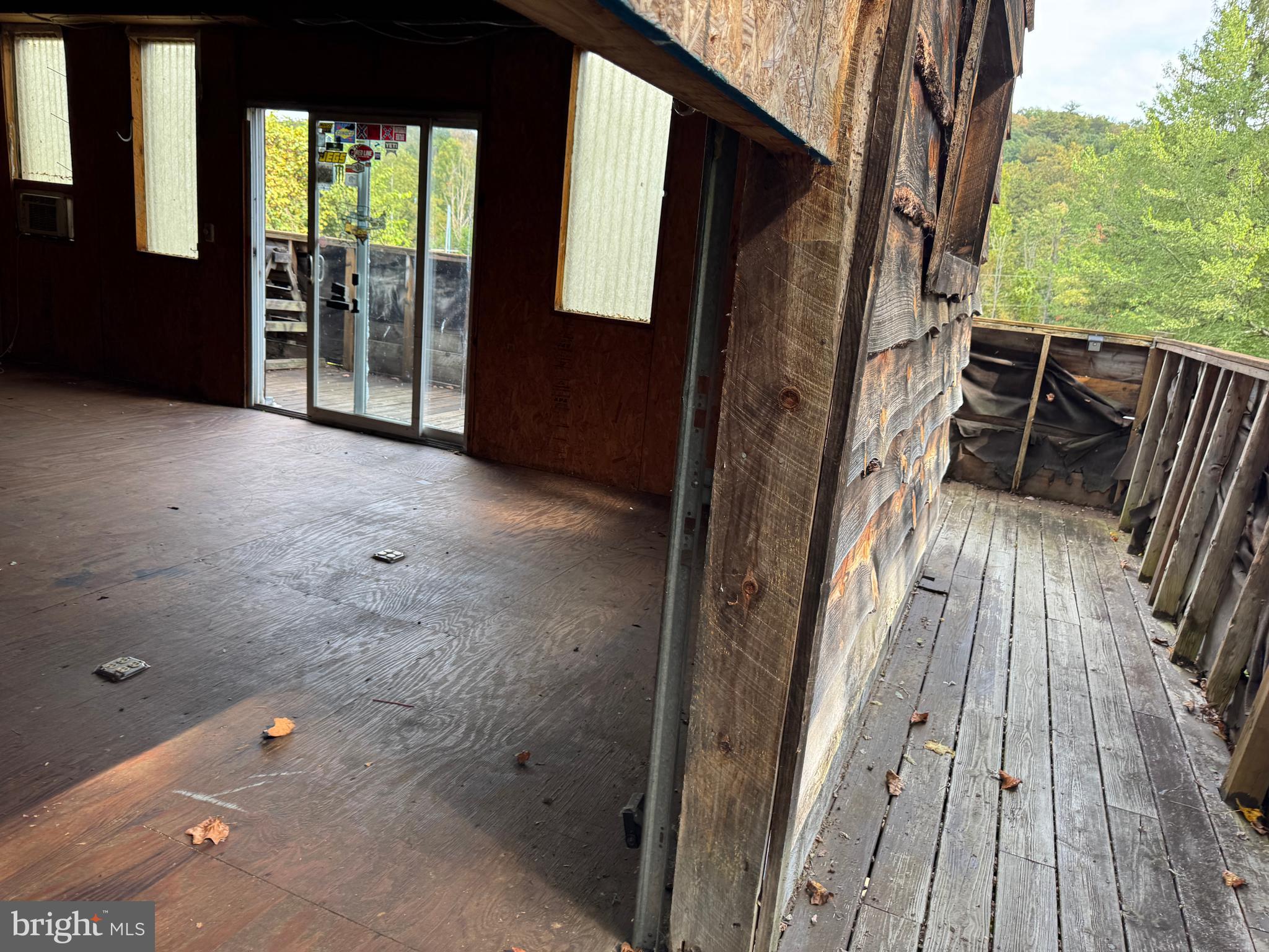 8922 Carpers Pike Yellow Spring, WV 26865 - Photo 23 of 23 a view of balcony with wooden floor and fence