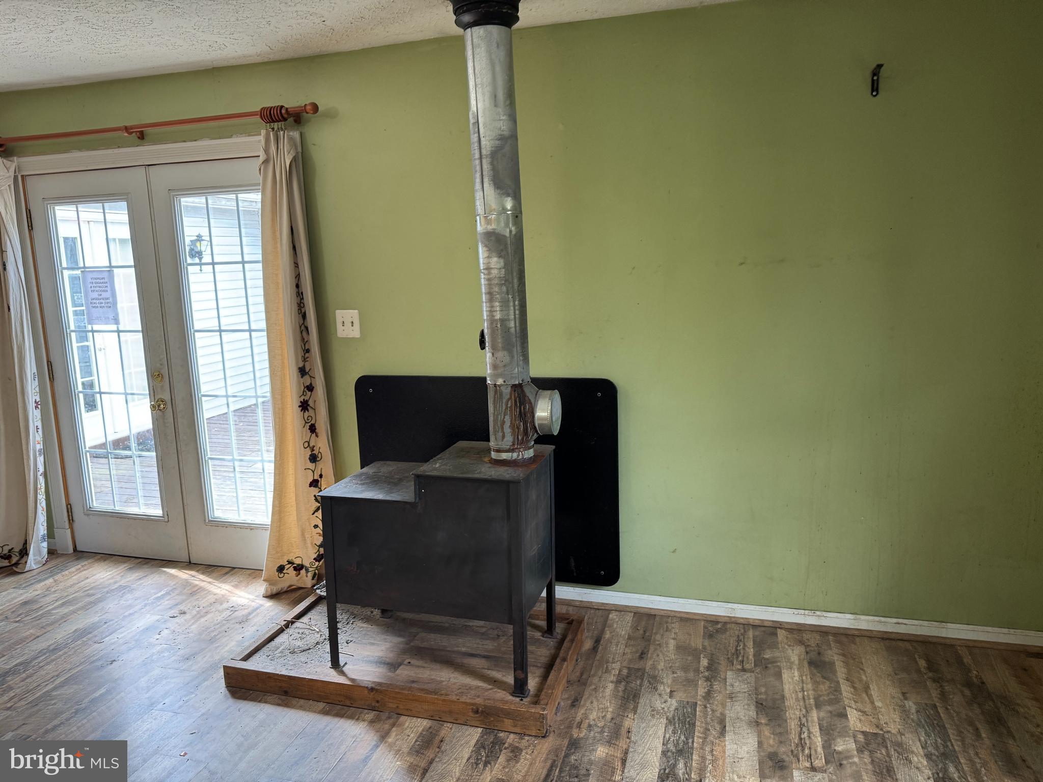 8922 Carpers Pike Yellow Spring, WV 26865 - Photo 8 of 23 a view of a workspace with furniture and wooden floor