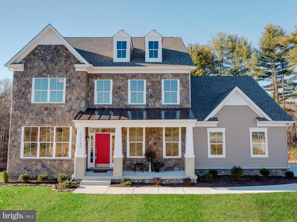 12504 Regwood Road Hydes, MD 21082 - Photo 2 of 28 a front view of a house with a yard