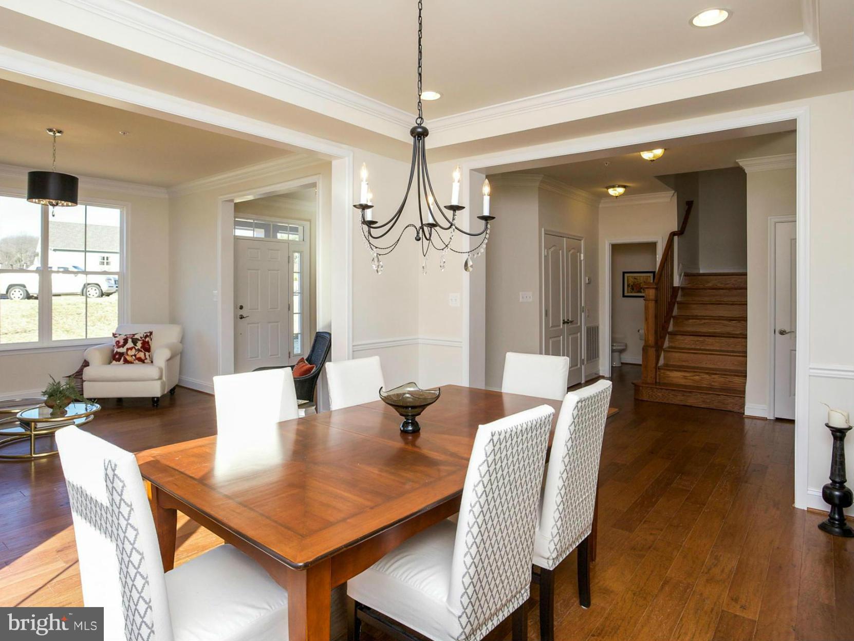 12504 Regwood Road Hydes, MD 21082 - Photo 9 of 28 a view of a dining room with furniture and wooden floor