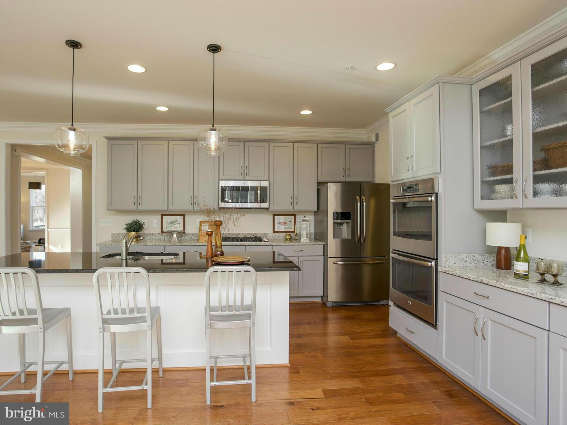 12504 Regwood Road Hydes, MD 21082 - Photo 15 of 28 a kitchen with refrigerator cabinets and a center island