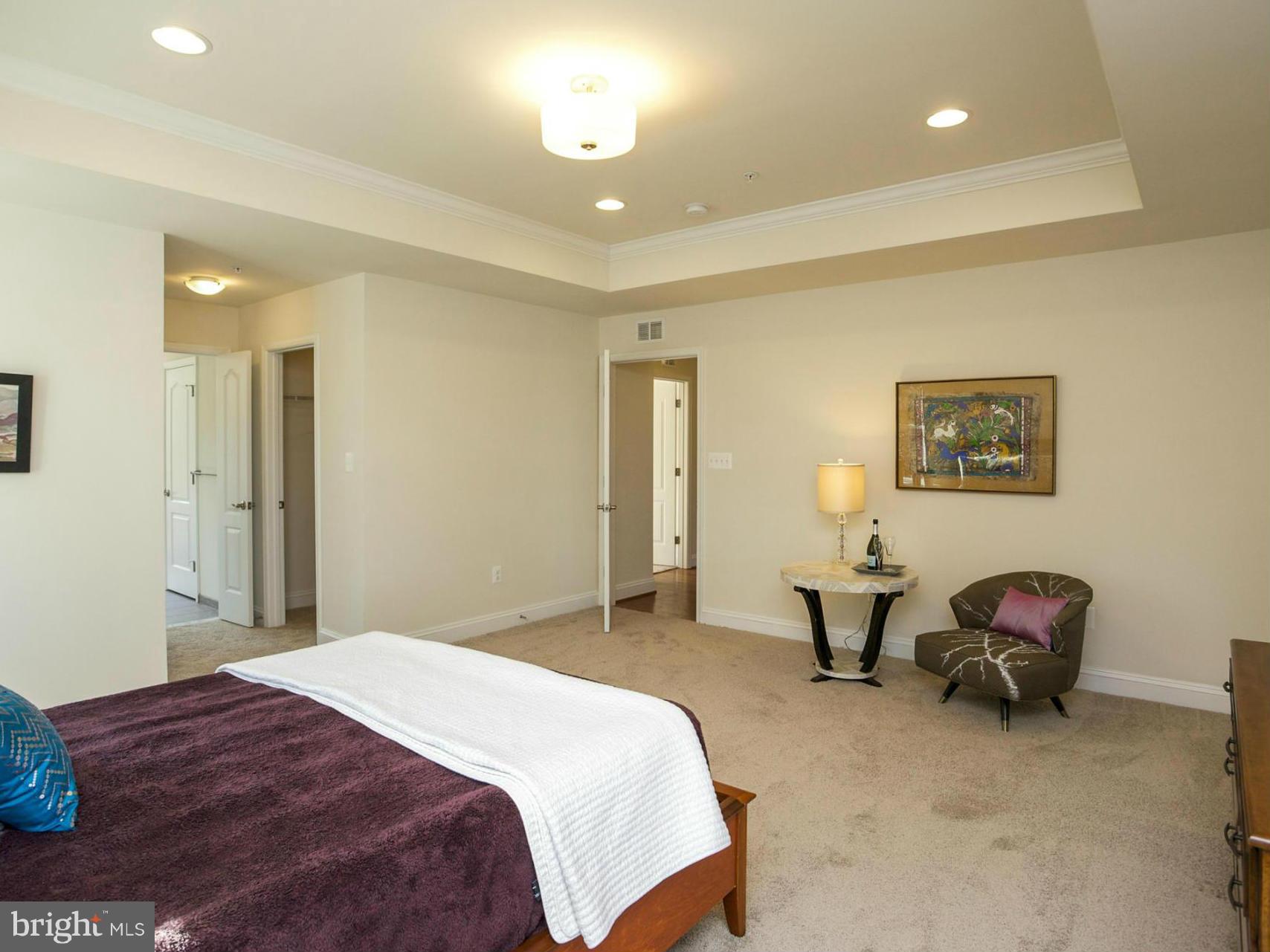 12504 Regwood Road Hydes, MD 21082 - Photo 19 of 28 a spacious bedroom with a bed a desk and chair