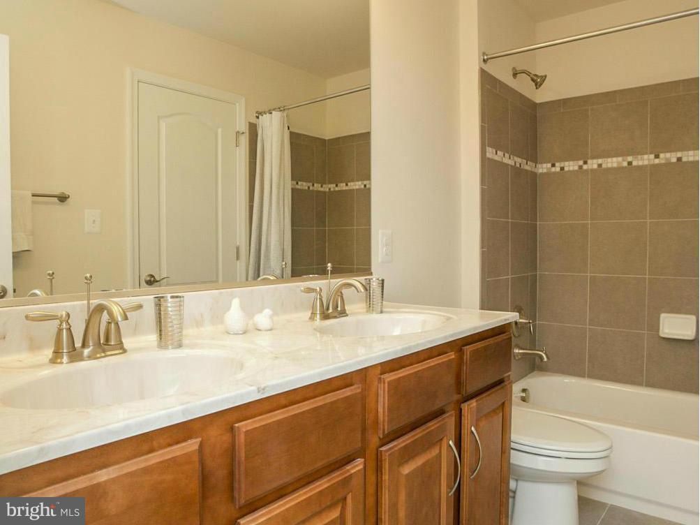 12504 Regwood Road Hydes, MD 21082 - Photo 24 of 28 a bathroom with a sink and a mirror
