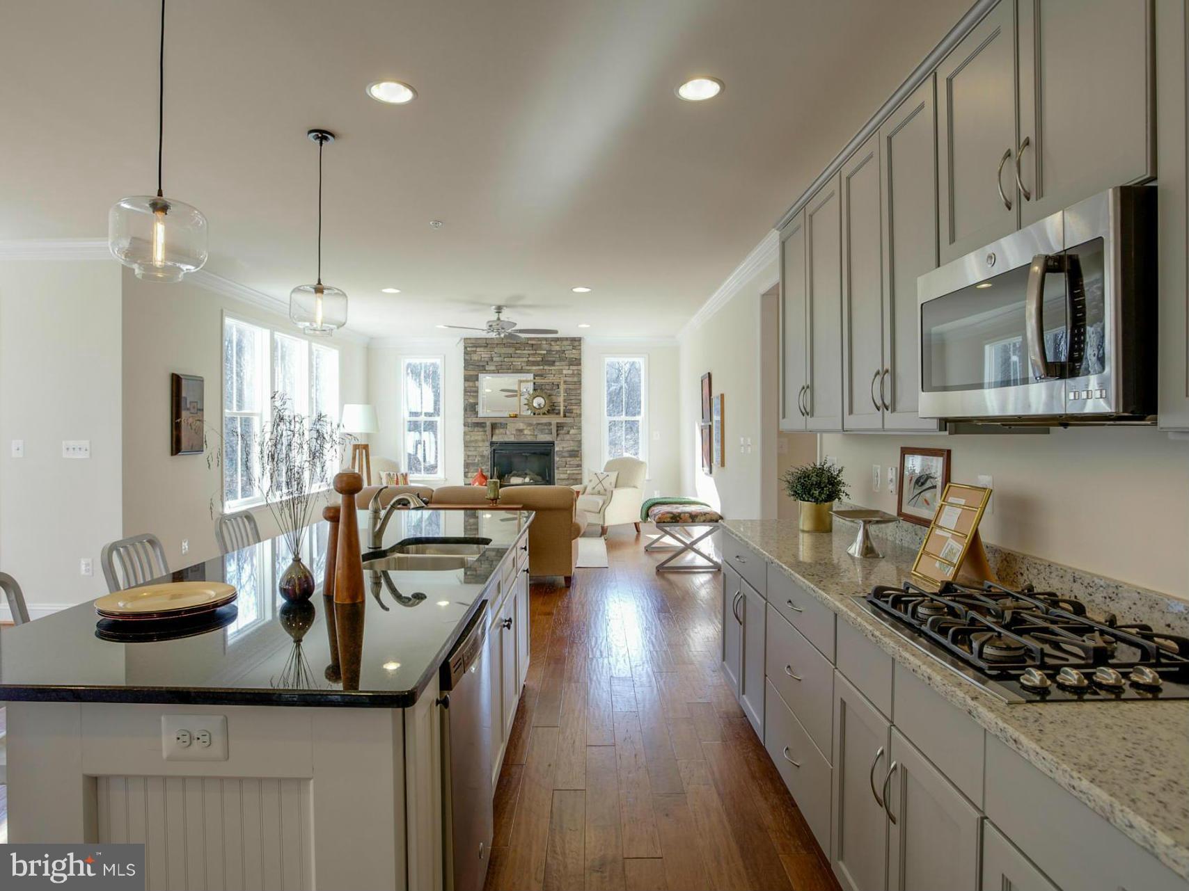 12504 Regwood Road Hydes, MD 21082 - Photo 4 of 28 a kitchen with sink a stove and cabinets