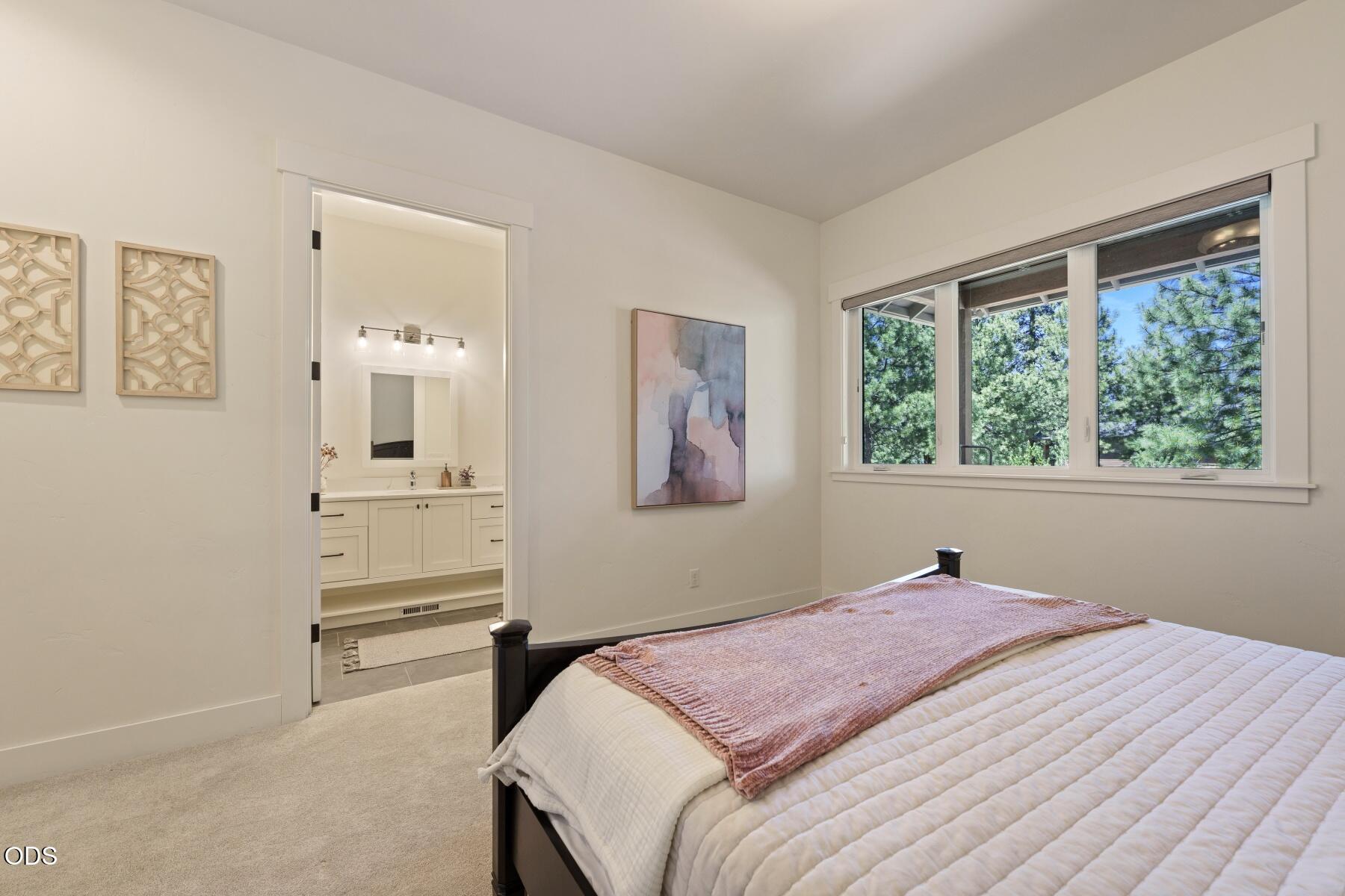 60255 Sunset View Drive Bend, OR 97702 - Photo 30 of 48 a bedroom with a bed and a window