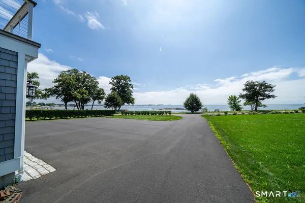 a view of street with tall trees
