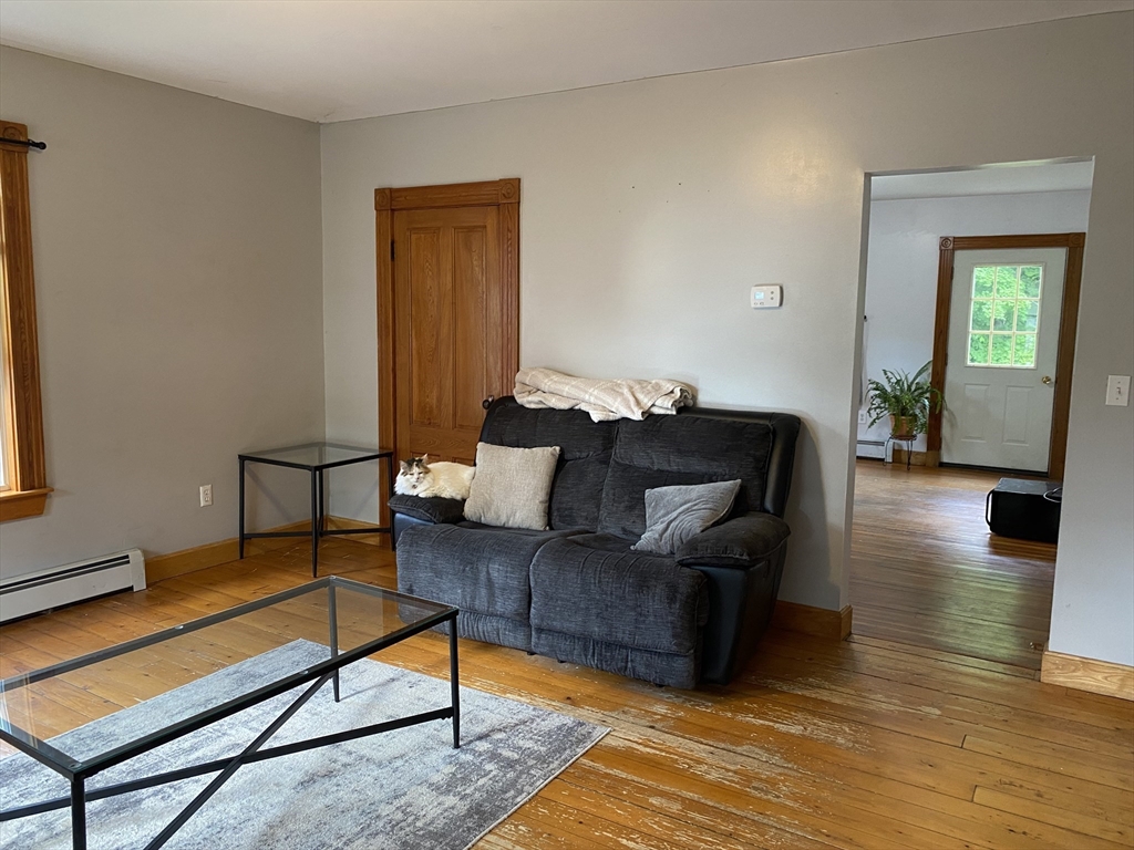 49-51 North Street Three Rivers, MA 01080 - Photo 5 of 21 a living room with furniture and a wooden floor