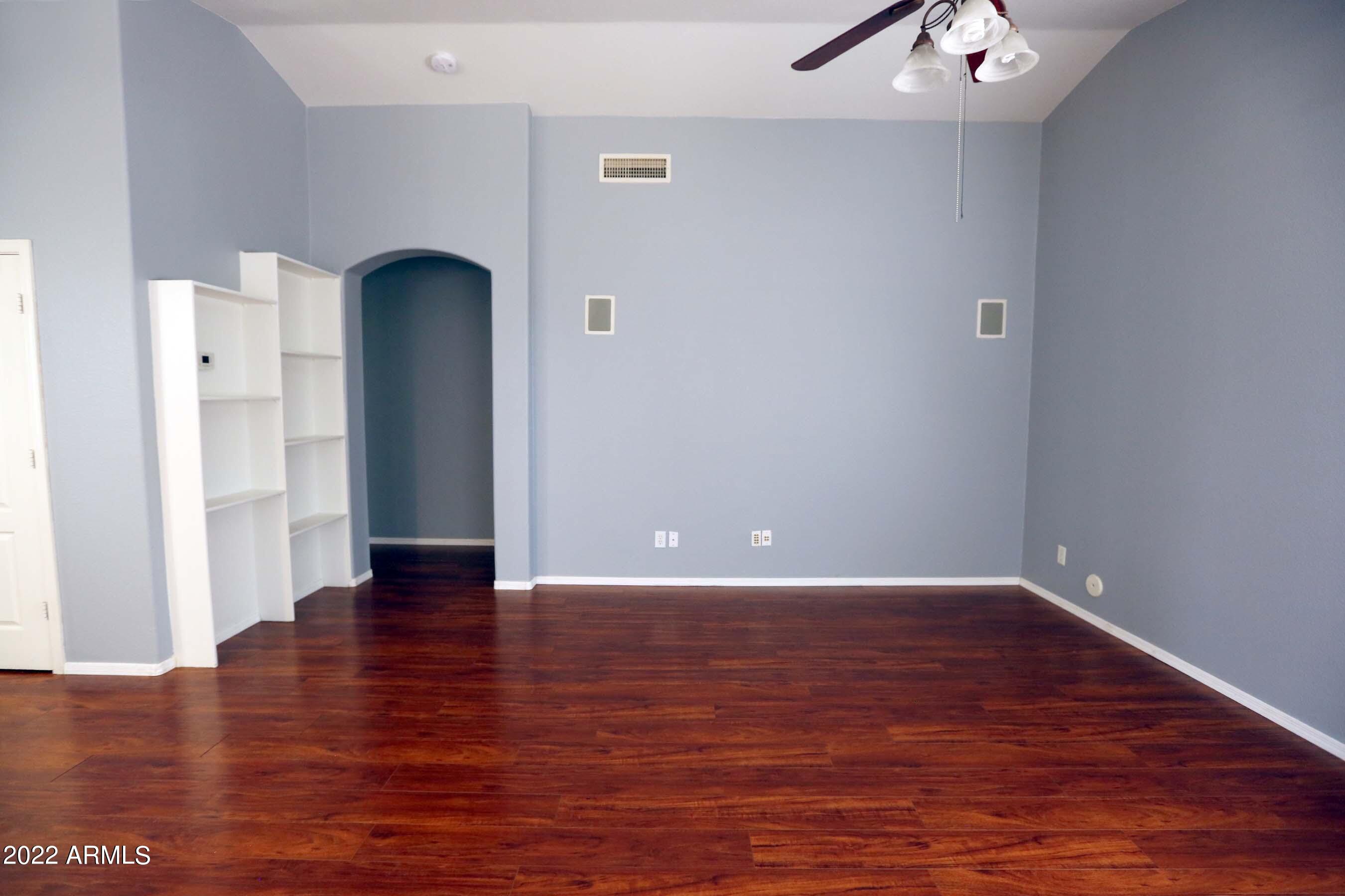 11217 West Edgemont Avenue Avondale, AZ 85392 - Photo 17 of 47 a view of an empty room with wooden floor