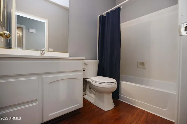 a bathroom with a toilet a sink and bathtub