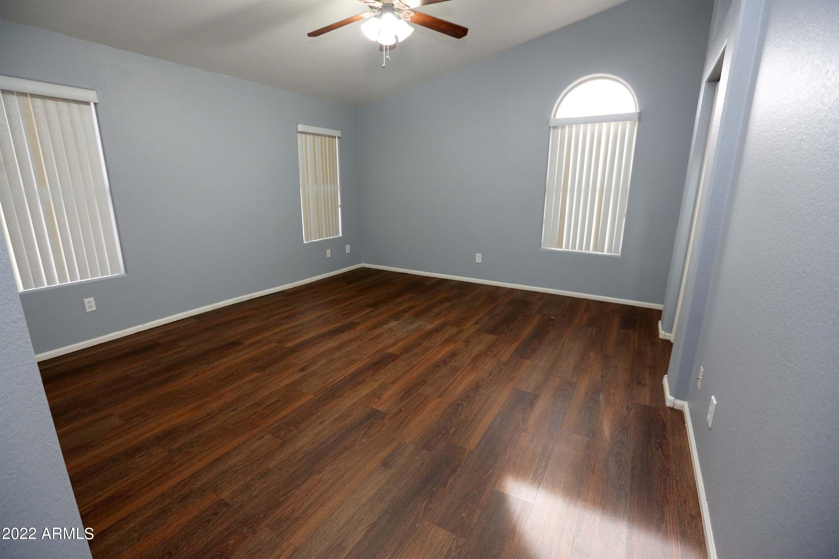 11217 West Edgemont Avenue Avondale, AZ 85392 - Photo 25 of 47 a view of empty room with window and wooden floor