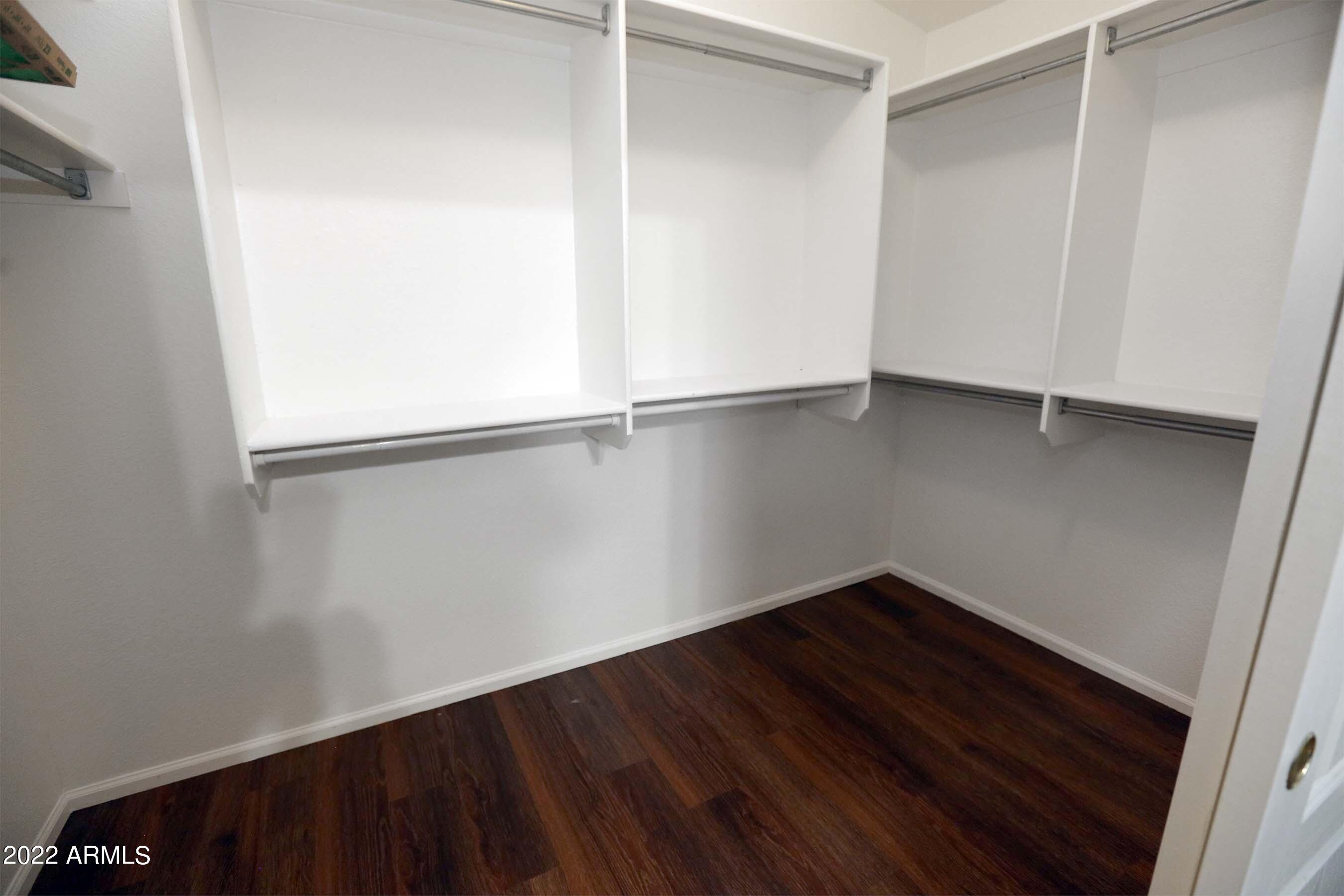 11217 West Edgemont Avenue Avondale, AZ 85392 - Photo 27 of 47 a view of an empty room with wooden floor