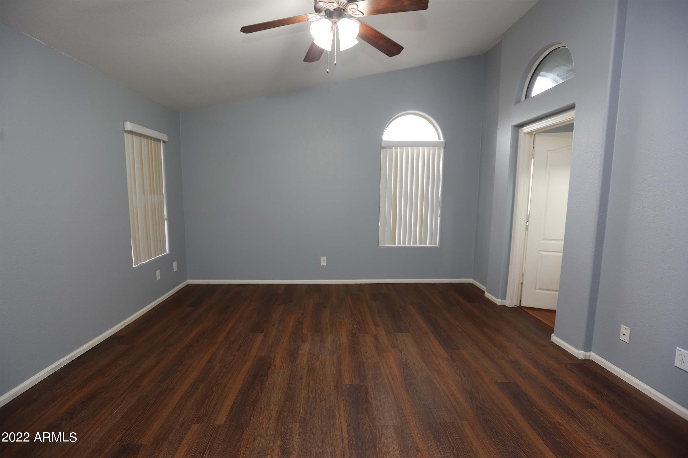 11217 West Edgemont Avenue Avondale, AZ 85392 - Photo 28 of 47 wooden floor in an empty room with a window