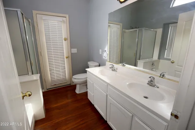 a white bath tub sitting next to a window