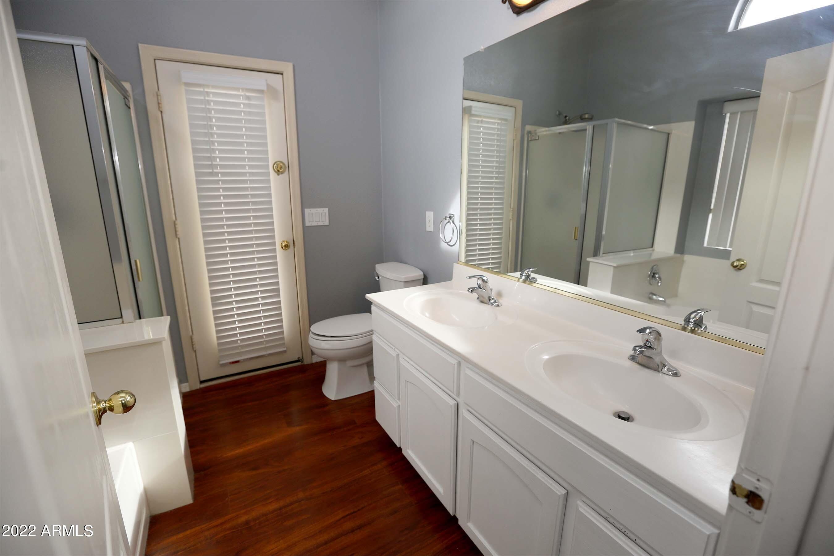 11217 West Edgemont Avenue Avondale, AZ 85392 - Photo 30 of 47 a bathroom with a sink and a mirror
